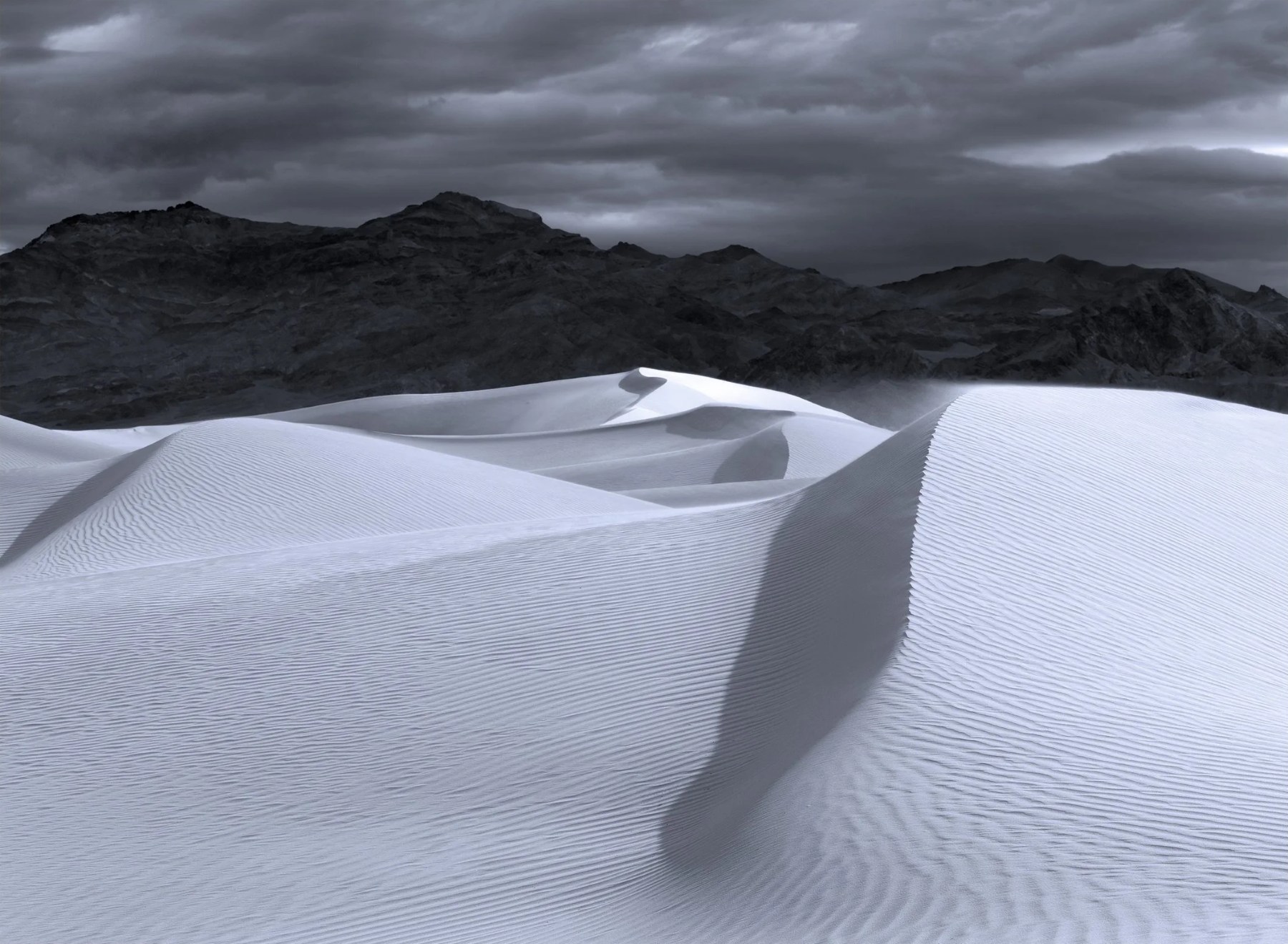 Dunes beneath storm clouds, Death Valley — Paul Rice